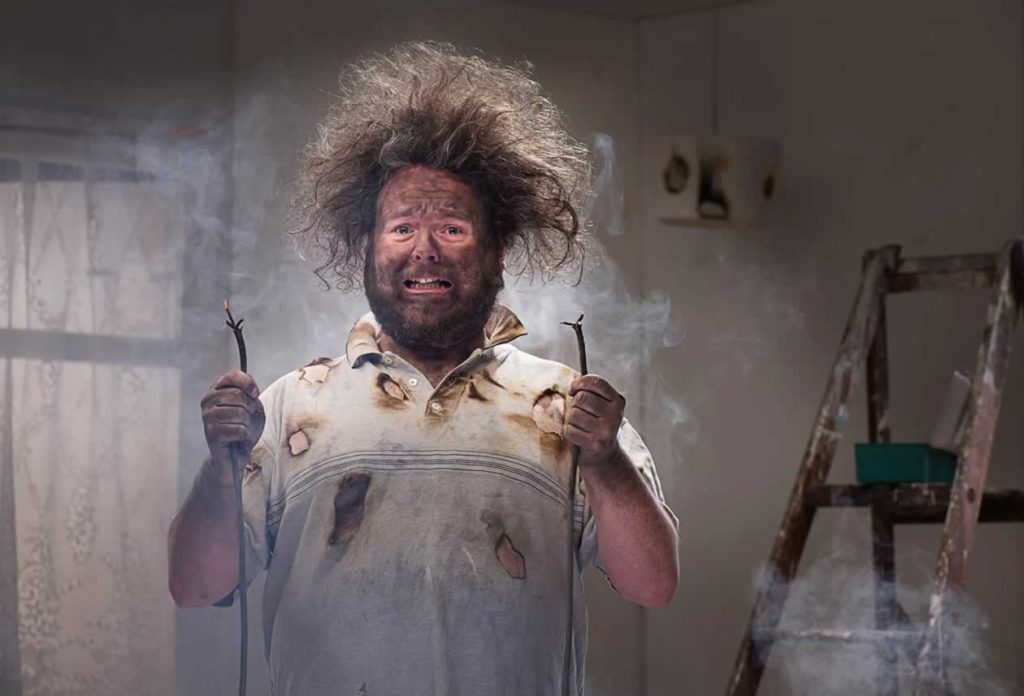 electrical emergency - humourous picture of a man who has supposedly received an electric shock from touching faulty wiring